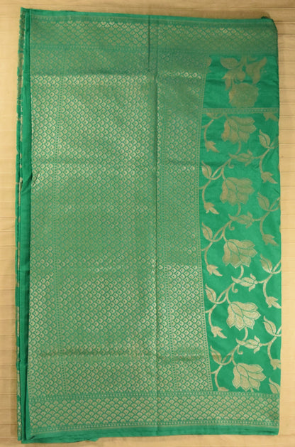 Luminous Emerald Green Floral Jaal Semi Banarasi Silk Saree