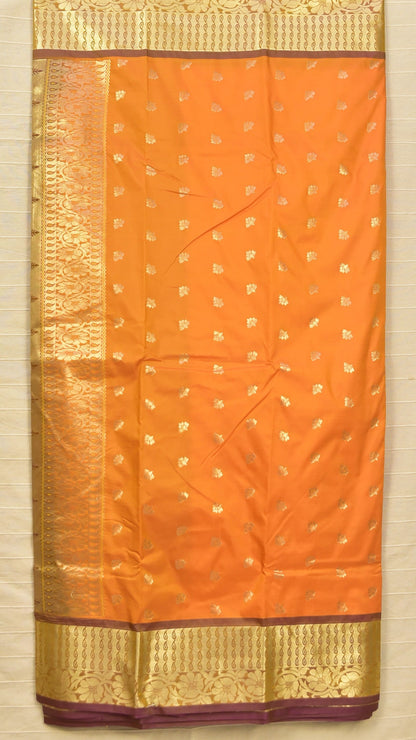 Radiant Orange Soft Silk Saree with Traditional Zari Elegance